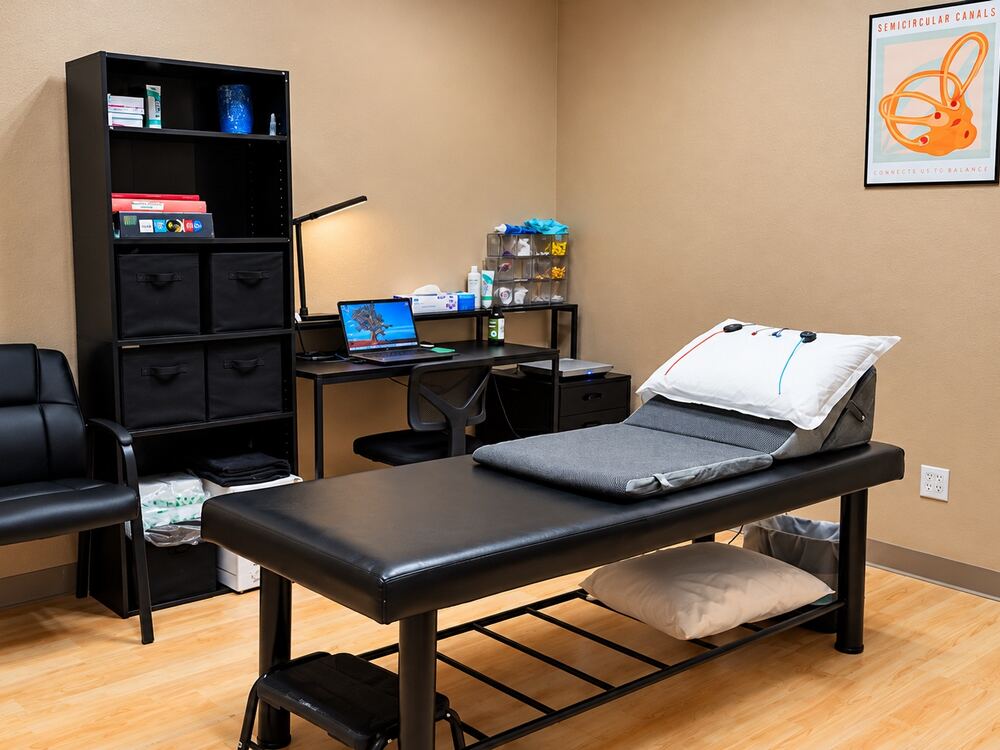 Vestibular and balance treatment room with exam table at Better Hearing Clinic in McAllen, TX