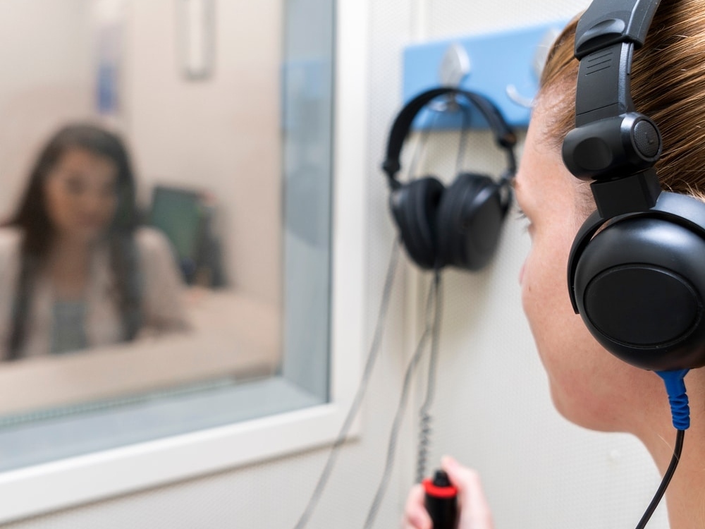 Doctor of Audiology conducting a comprehensive hearing evaluation with a patient at Better Hearing Clinic in McAllen, TX